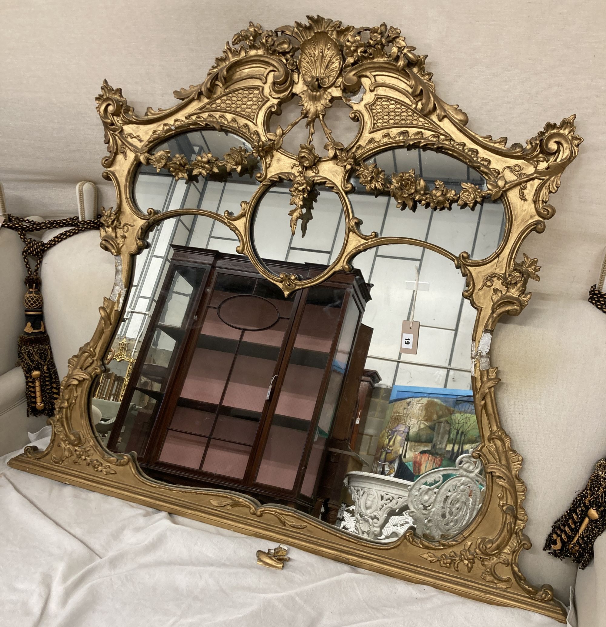 A late Victorian giltwood and gesso overmantel mirror, width 108cm, height 115cm